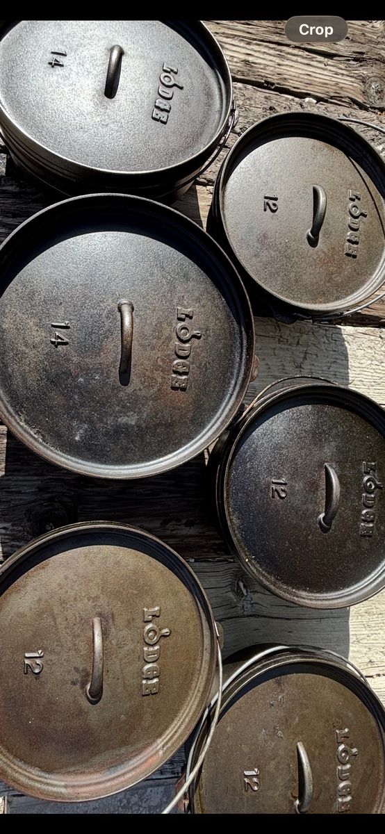 Lodge cast iron Dutch ovens 12" & 14"  with bags and lid lifters for sale