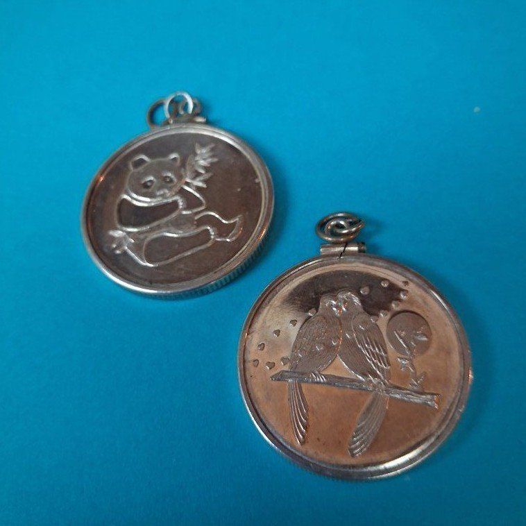2 .999 SILVER 1/2 OZ. TOKENS W/BEZZELS.