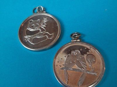 2 .999 SILVER 1/2 OZ. TOKENS W/BEZZELS.