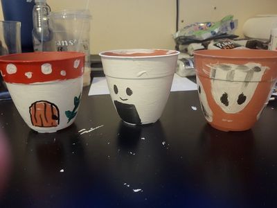 hand painting plant pots