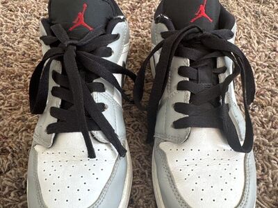 Grey, red, and black air jordans