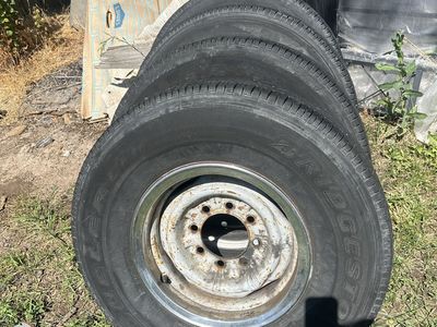 Set of 4 Bridgestone Dueler LTH Tires LT235/85R16 on 8-Lug Steel Wheels
