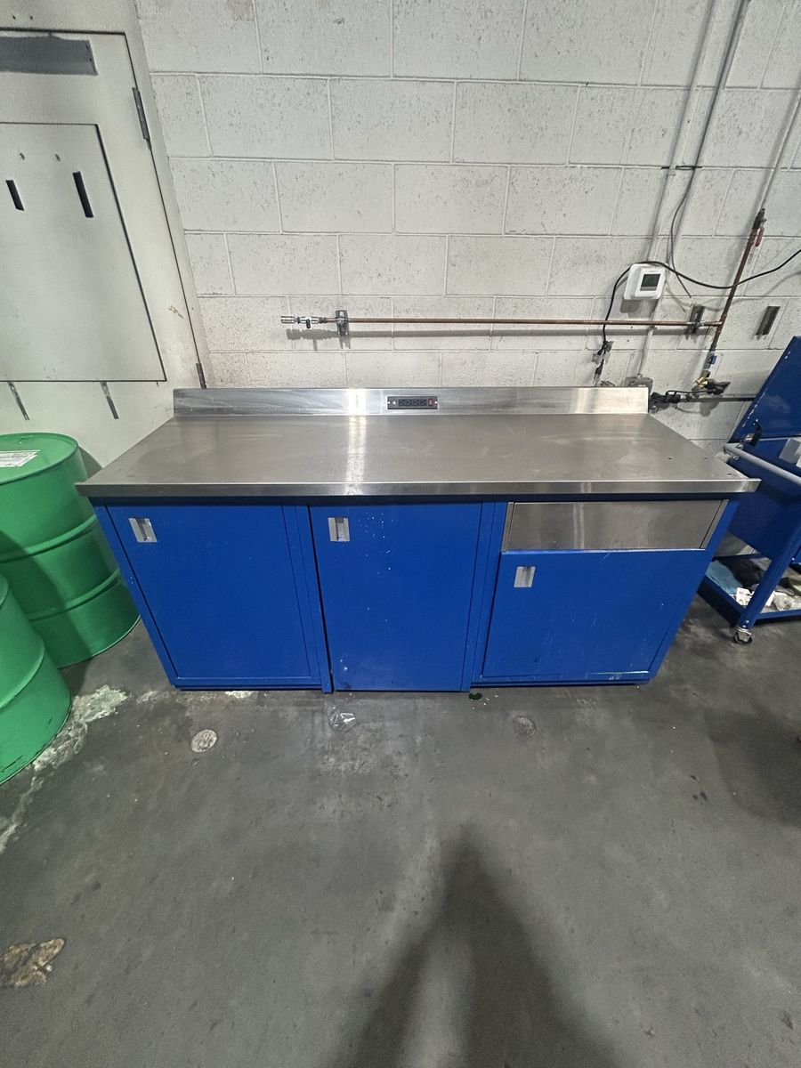 Industrial Stainless Steel Work Bench with Blue Cabinets and power cable