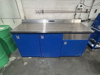 Industrial Stainless Steel Work Bench with Blue Cabinets and power cable
