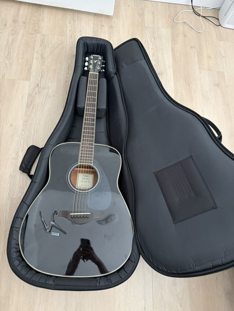 Black Yamaha Acoustic Guitar