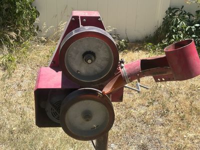 Older pitching machine with practice balls