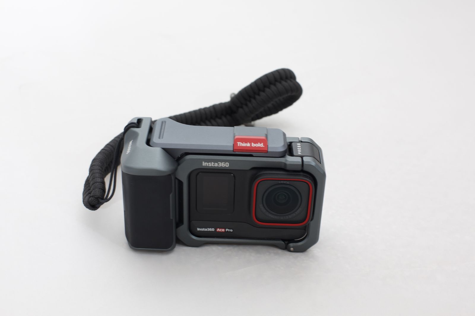 Insta360 Ace Pro action camera with Tilta protective cage and wrist strap.