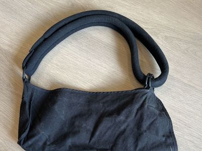 Black Fabric Arm Sling with Thick Padded Shoulder Strap Used