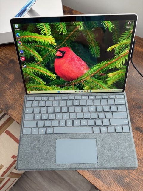 Microsoft Surface X 2 in 1 (laptop and tablet) complete with keyboard and charger.