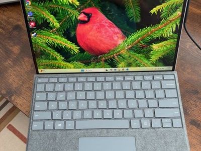 Microsoft Surface X 2 in 1 (laptop and tablet) complete with keyboard and charger.