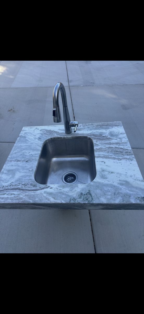 Gray & White Granite Countertop with Stainless Steel Sink and Faucet