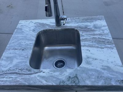 Gray & White Granite Countertop with Stainless Steel Sink and Faucet