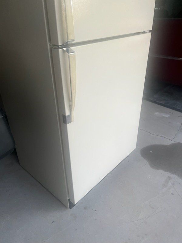 bisque or almond kelvinator fridge. cools and freezes well.