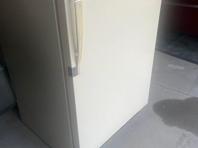 bisque or almond kelvinator fridge. cools and freezes well.