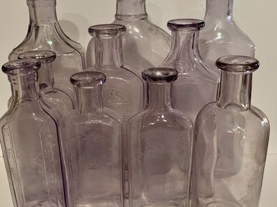 10 old purple whiskey & medicine bottles