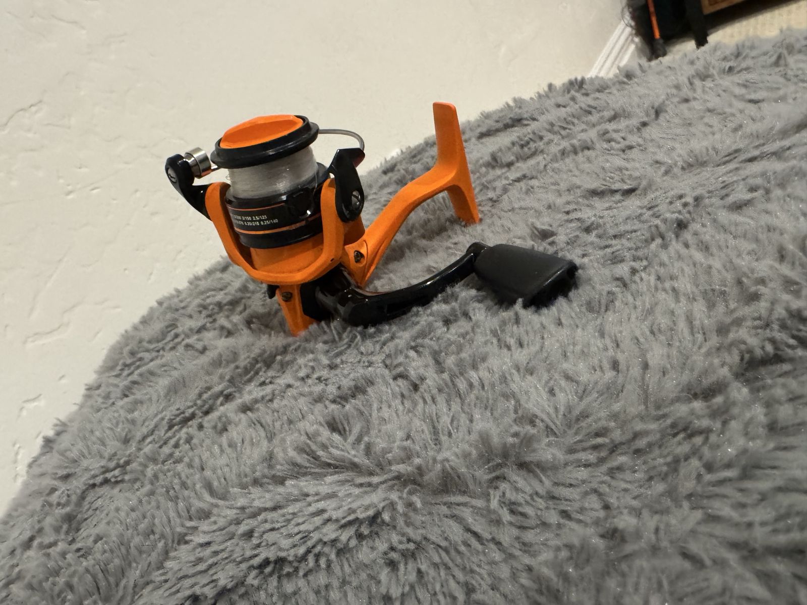 Orange & Black Fishing Reel - Pre-spooled with line
