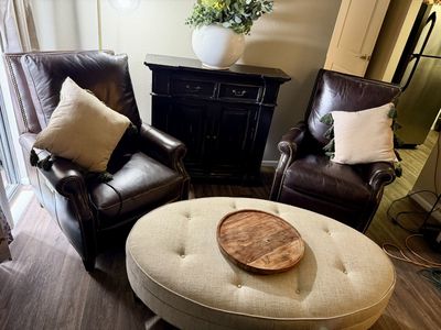 Ashley Furniture 2 brown leather reclining chairs and coffee table