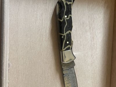 Red Duck Damascus folding knife