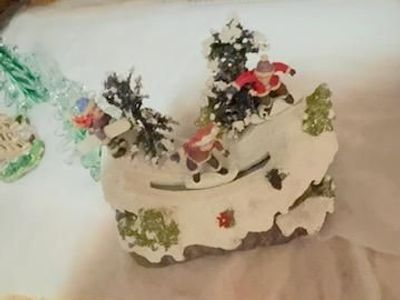 Animated Christmas village ice skating scene, lights, music, moving figures,