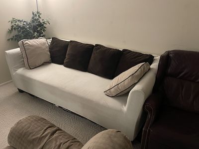 White Textured Slipcover Sofa with Brown Back Cushions
