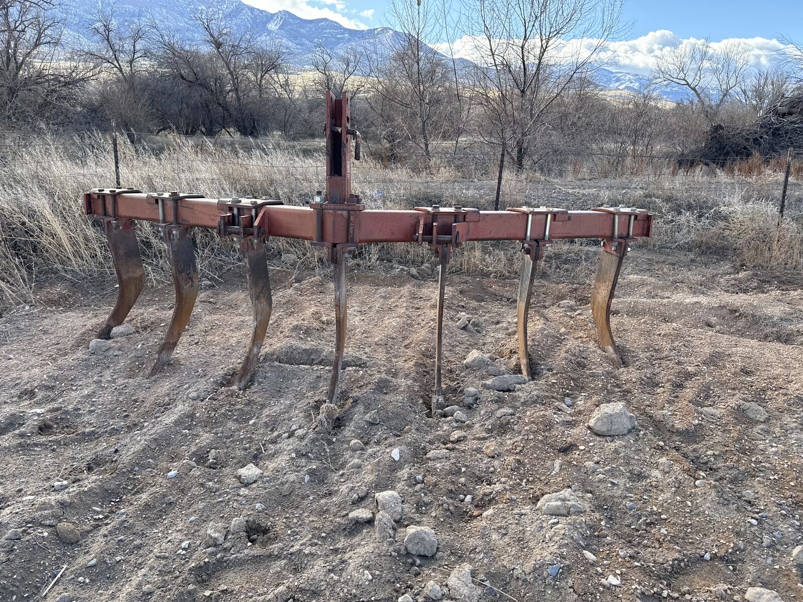 Seven shank chisel plow