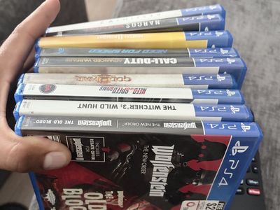 Sony PlayStation 4 Console Bundle with 2 Controllers and 9 Games