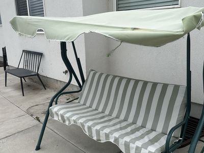 Green Striped Swinging Bench