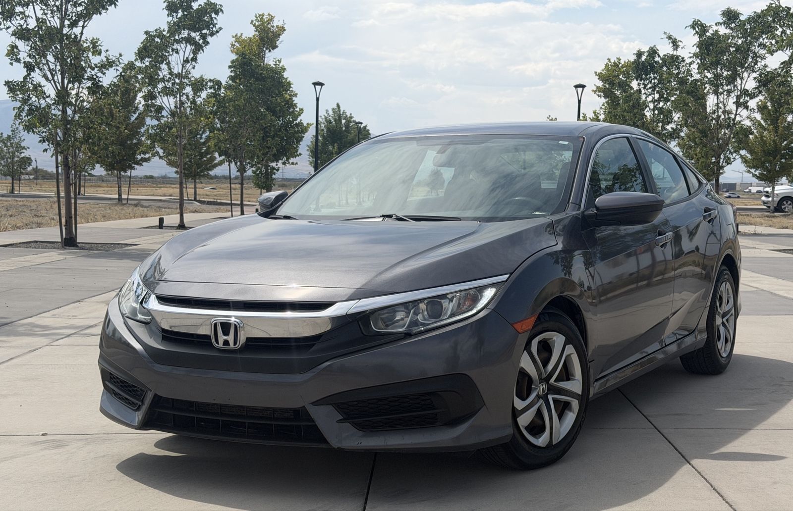 2017 Honda Civic LX — rebuilt & branded title, 34% below market