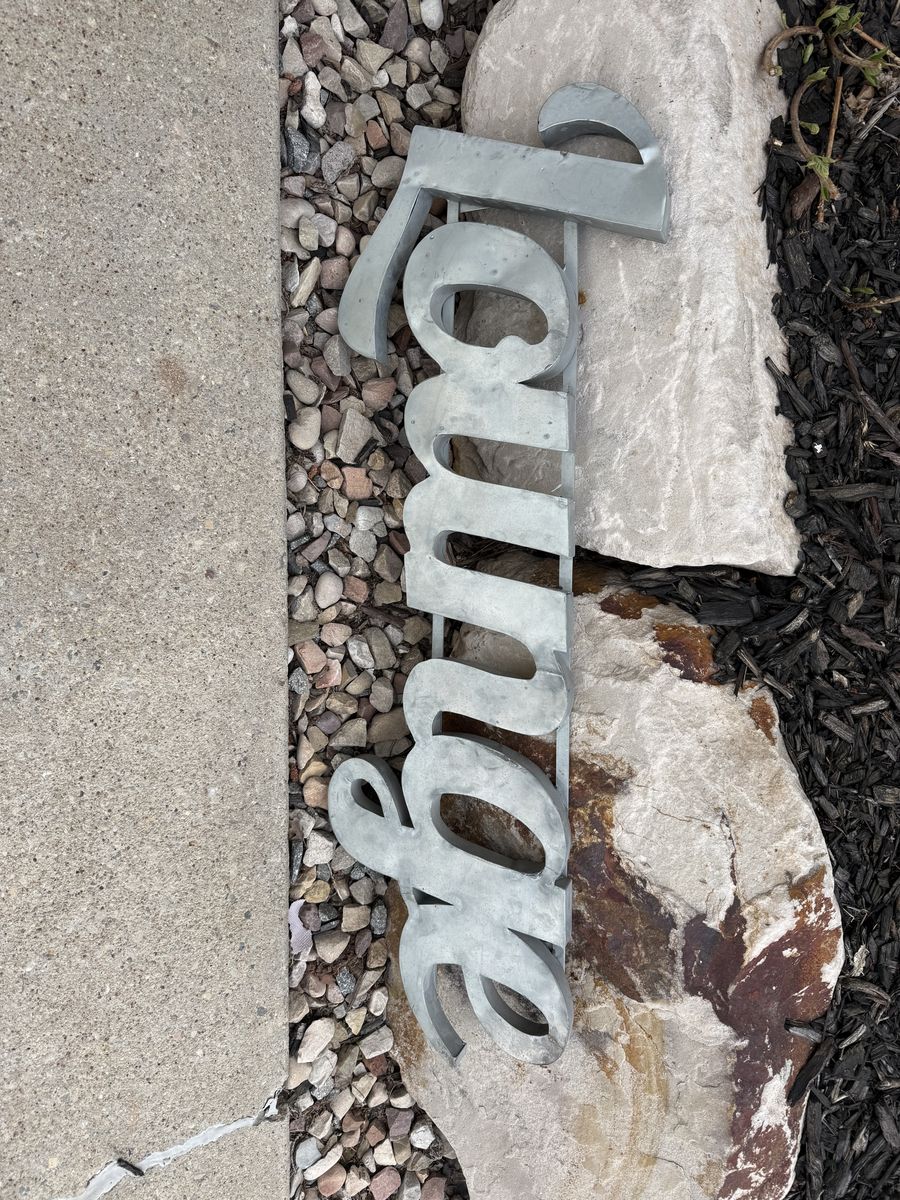 Metal “Lounge” sign