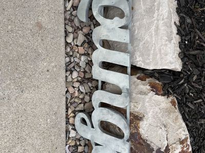 Metal “Lounge” sign