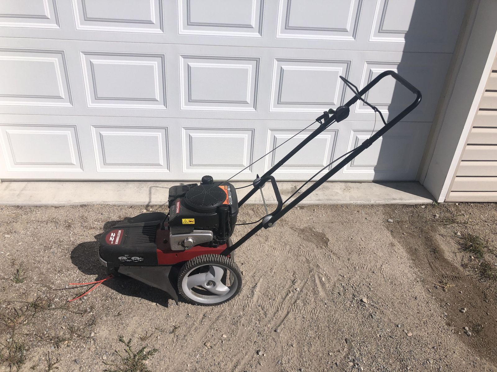 near new walk behind weed trimmer