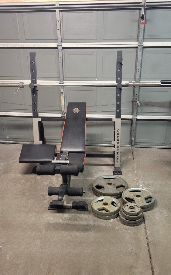 Bench and 245 pounds of weights