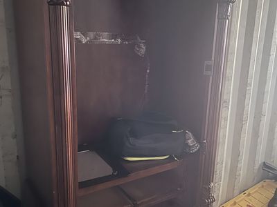 Armoire closet with glass mirror door