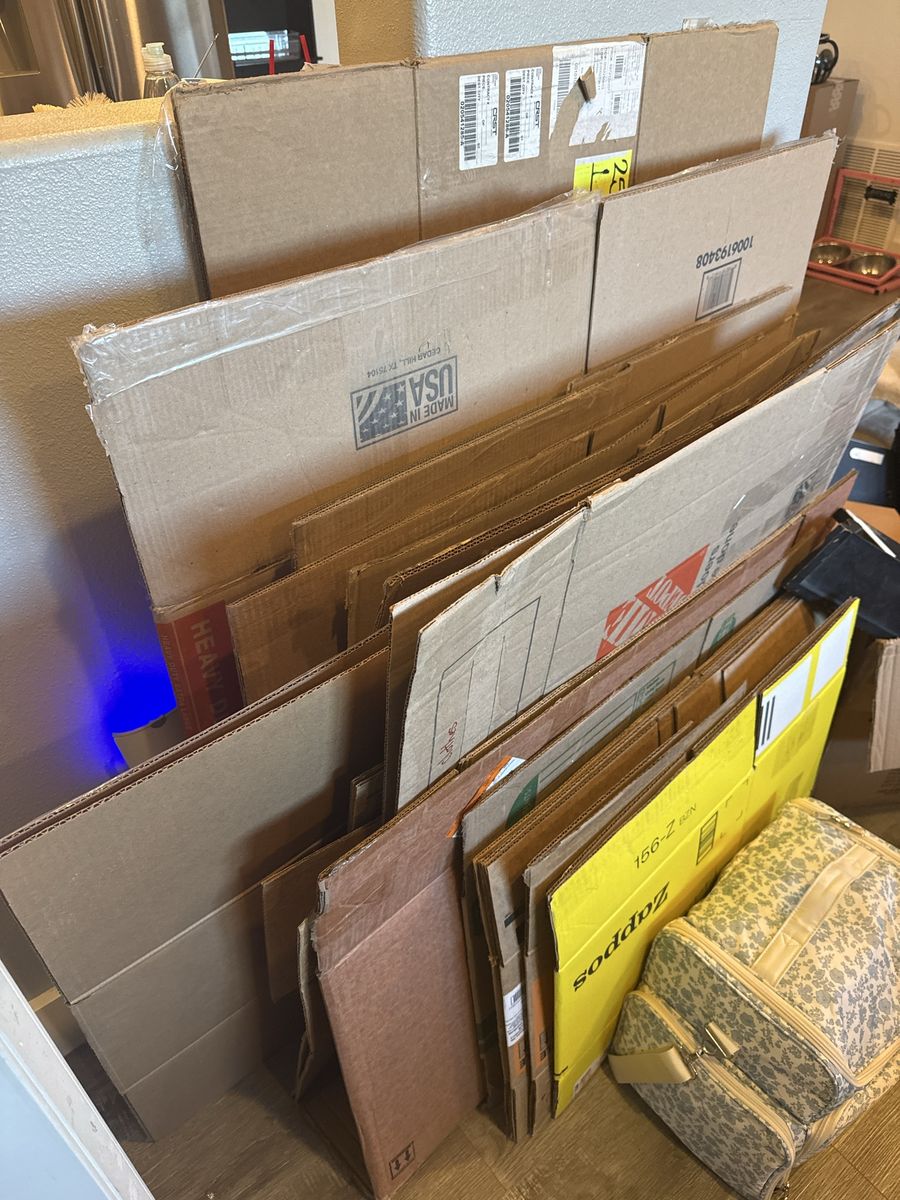 Assorted Cardboard Moving Boxes and Packing Materials