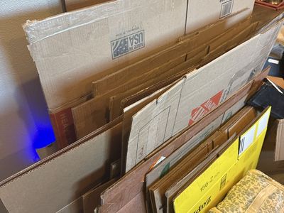 Assorted Cardboard Moving Boxes and Packing Materials