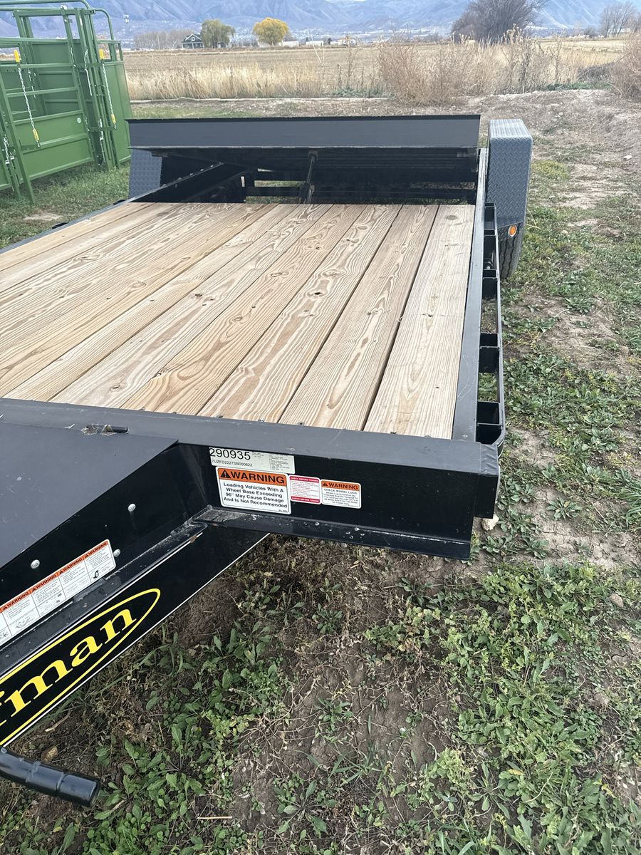 2025 Black Tilt Deck Utility Trailer with Wood Deck and Dual Axles