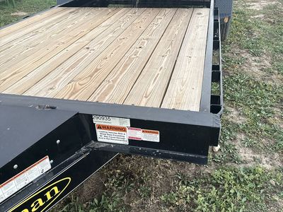 2025 Black Tilt Deck Utility Trailer with Wood Deck and Dual Axles