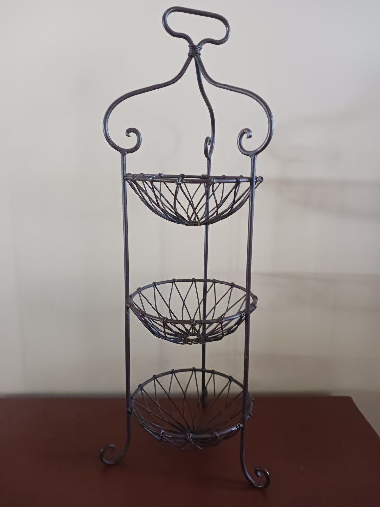 Three tiered metal stand