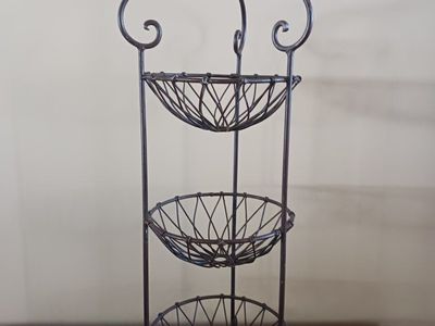 Three tiered metal stand