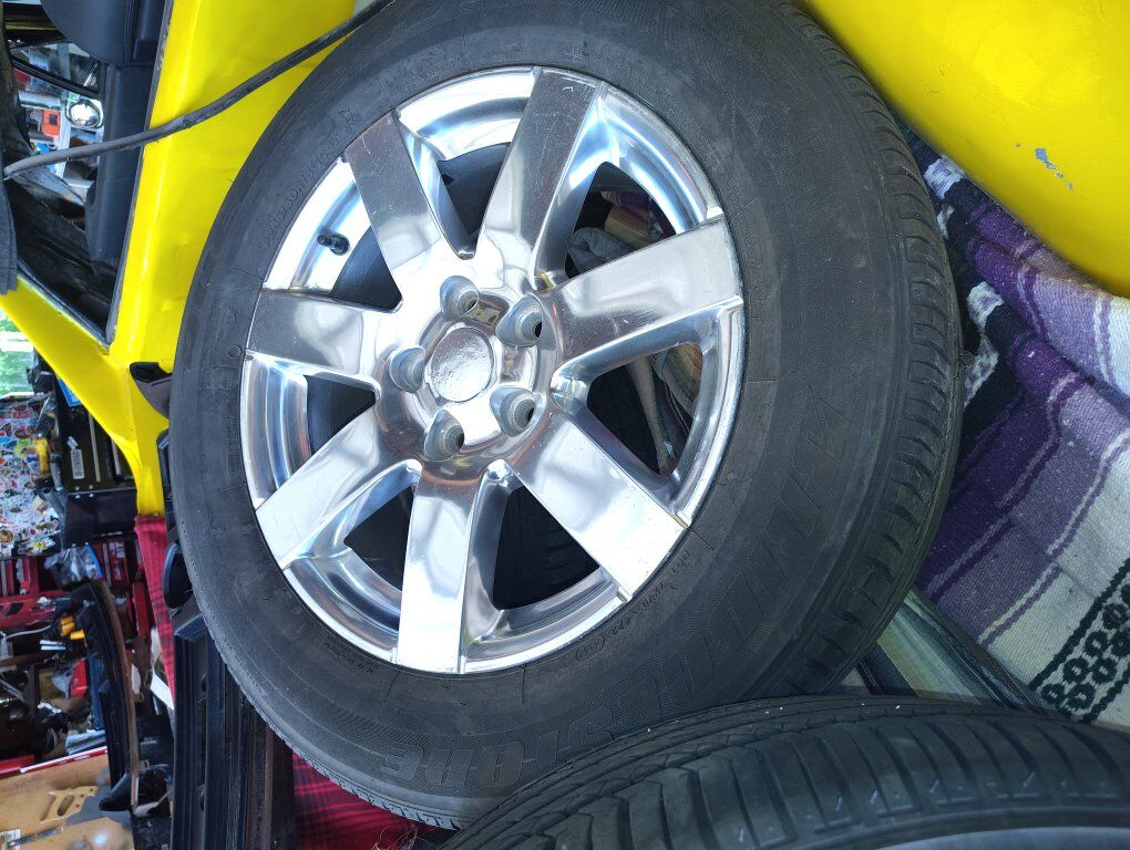Four Jeep wheels &Two tires..Snow?
