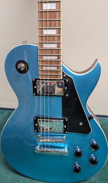 Benssica Les Paul-style electric guitar, metallic blue finish, Dual humbucker pickups, traditional 4-knob control setup