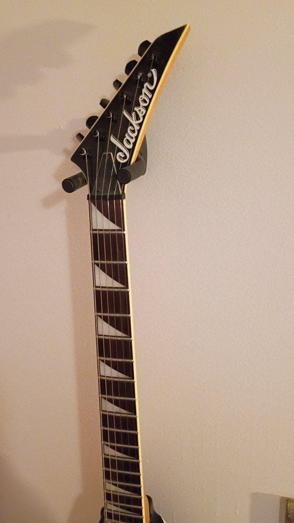 Jackson Rhoads King V Electric Guitar - Black with White Pickguard with fine tuning & Sharkfin fret inlays 