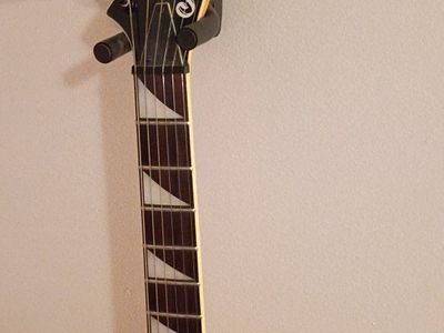 Jackson Rhoads King V Electric Guitar - Black with White Pickguard with fine tuning & Sharkfin fret inlays