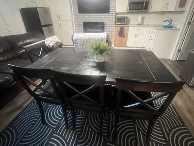 Black Wooden Dining Table Set with Cross-Back Chairs