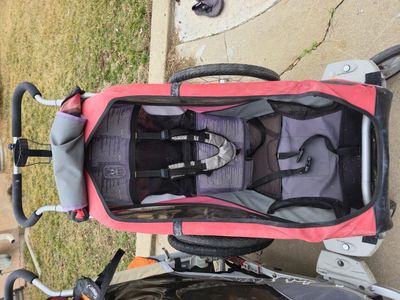 Single red jogging stroller / bike trailer