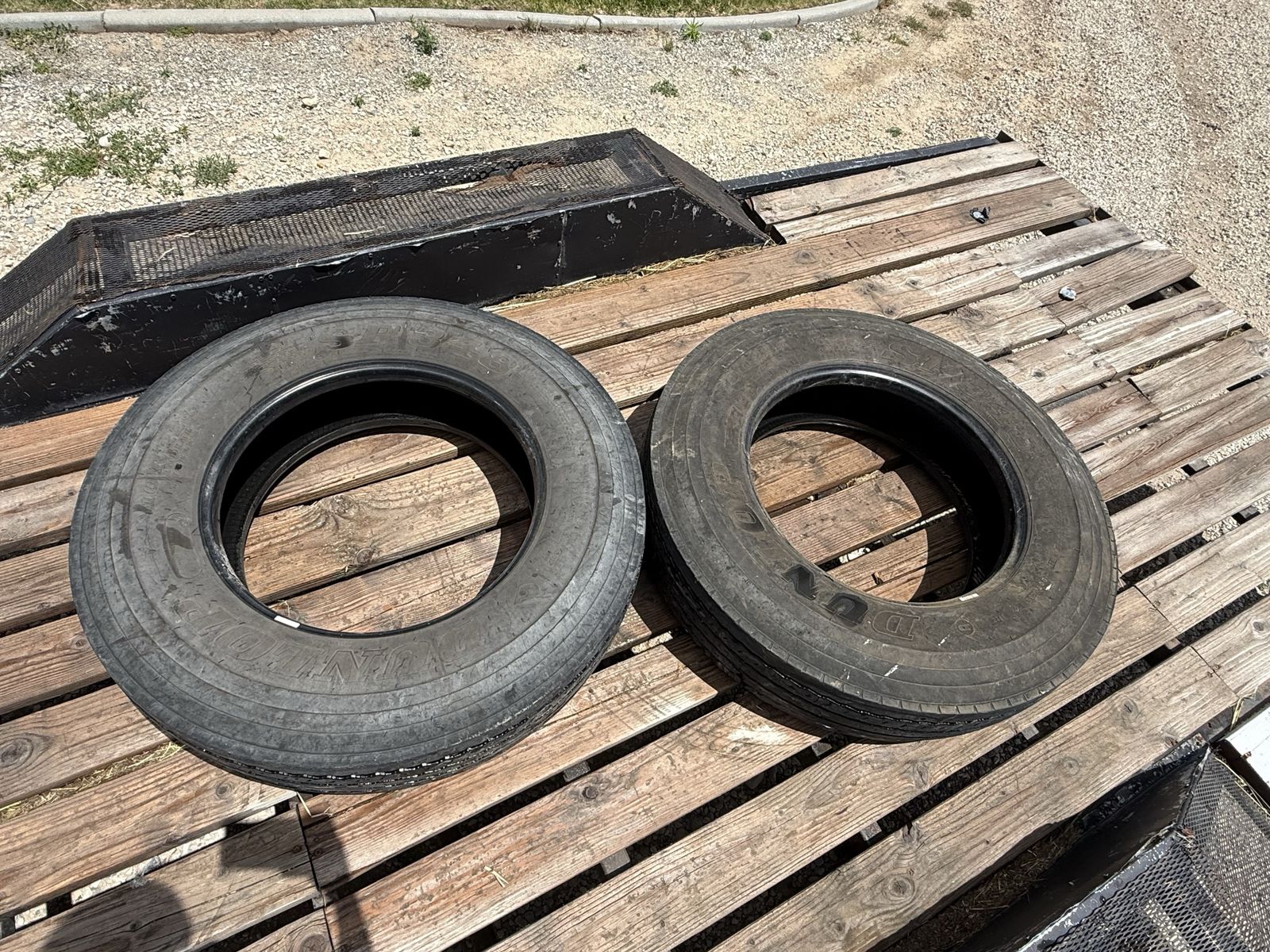 Pair of Dunlop SP348 10R22.5 radial tubeless truck tires.