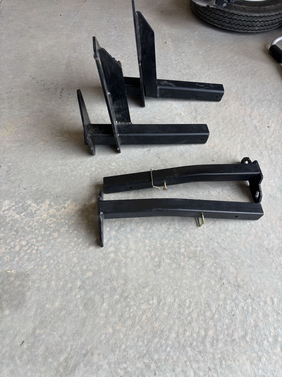 Torklift International Ram 3500 Rear Tie Downs. Black Steel Hitch-Mounted Carrier Arms for truck camper - Set of 2