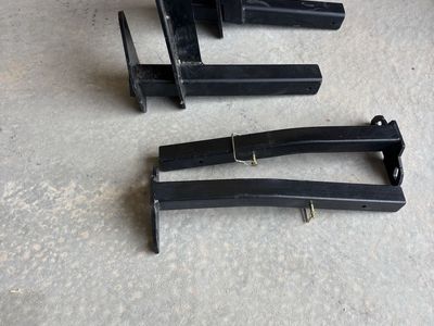 Torklift International Ram 3500 Rear Tie Downs. Black Steel Hitch-Mounted Carrier Arms for truck camper - Set of 2