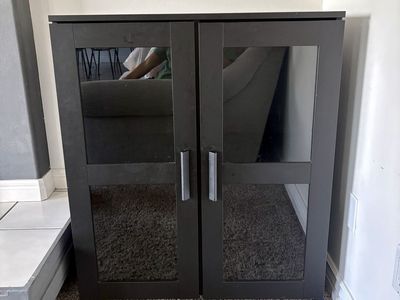 Black Storage Cabinet with Glass Doors and Shelves