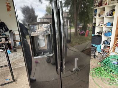 Black GE Side-by-Side Refrigerator with Water Dispenser